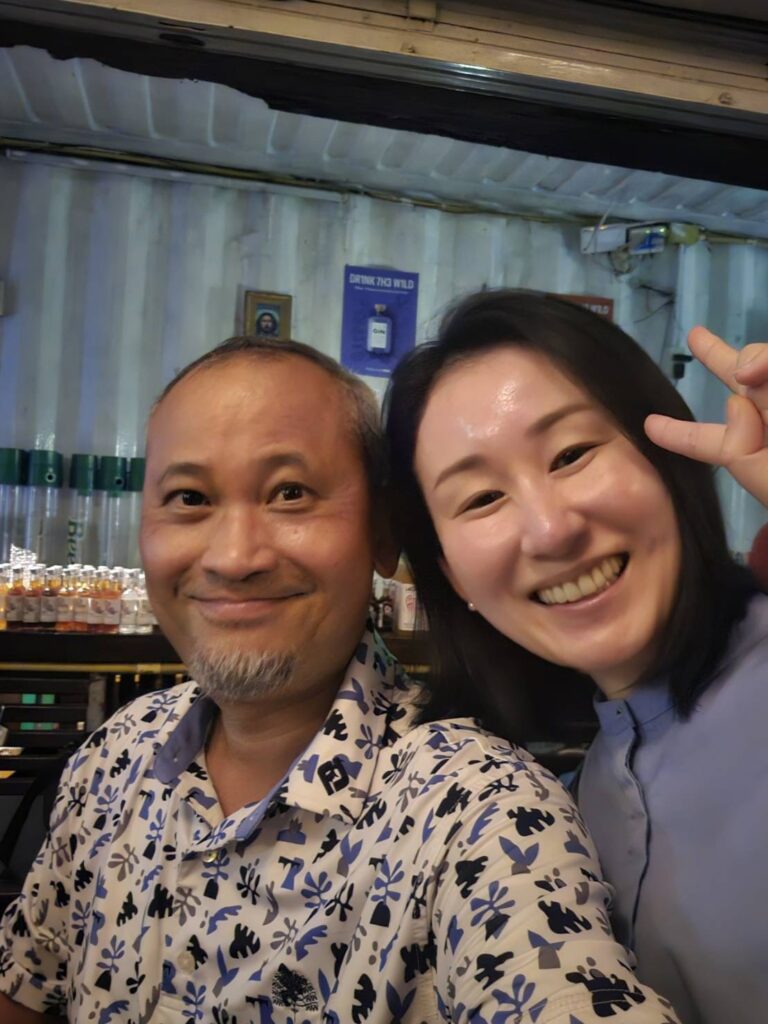Japanese Whisky and Rum Expert Mika Tanimoto with CEO Mr. Sihata and Mr. Inoue at LAODI Distillery, celebrating their partnership."