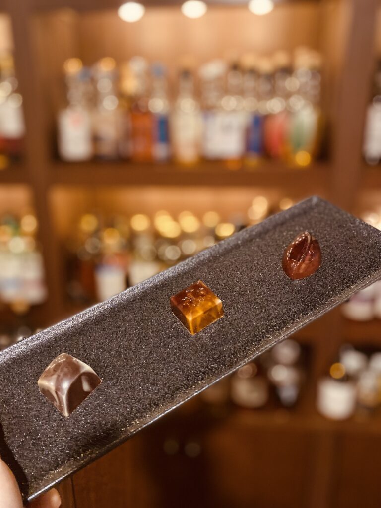 Exquisite craft chocolates specifically designed to pair with premium Japanese whisky, served at Bar Little Happiness in Hiroshima.