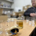 Japanese Whisky Expert Mika Tanimoto tasting 'beautiful' spirits with President Tokida at Kameda Distillery. A moment of 'Hitsuzen' (Inevitability) where logic and passion meet.