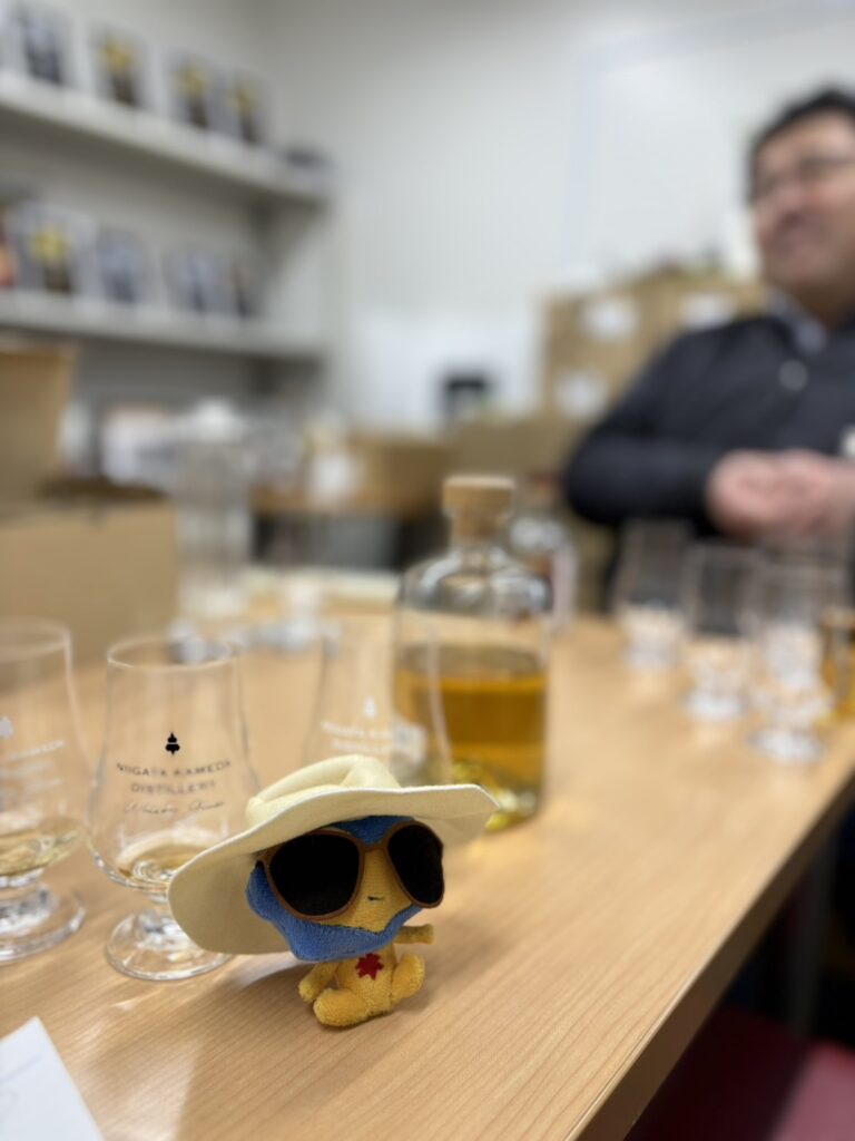 Japanese Whisky Expert Mika Tanimoto tasting 'beautiful' spirits with President Tokida at Kameda Distillery. A moment of 'Hitsuzen' (Inevitability) where logic and passion meet.