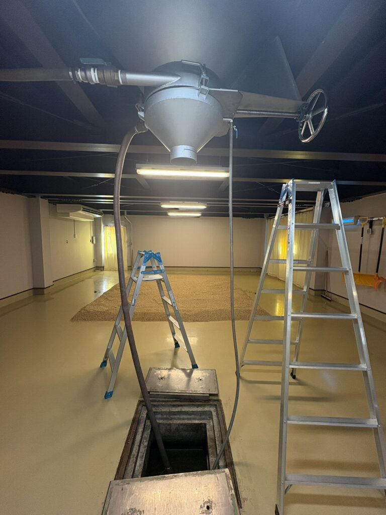 Mika Tanimoto of Bar Little Happiness Hiroshima experiencing traditional floor malting at Chichibu Distillery, the holy land of Japanese whisky."