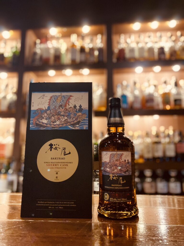 The rare Sakurao Single Malt Hiroshige Collection with a traditional Japanese fan, a symbol of luck and Hiroshima pride, reviewed by Mika Tanimoto.