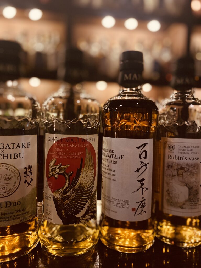 A bottle of Mars Whiskey from Nagano on the counter at Bar Little Happiness.