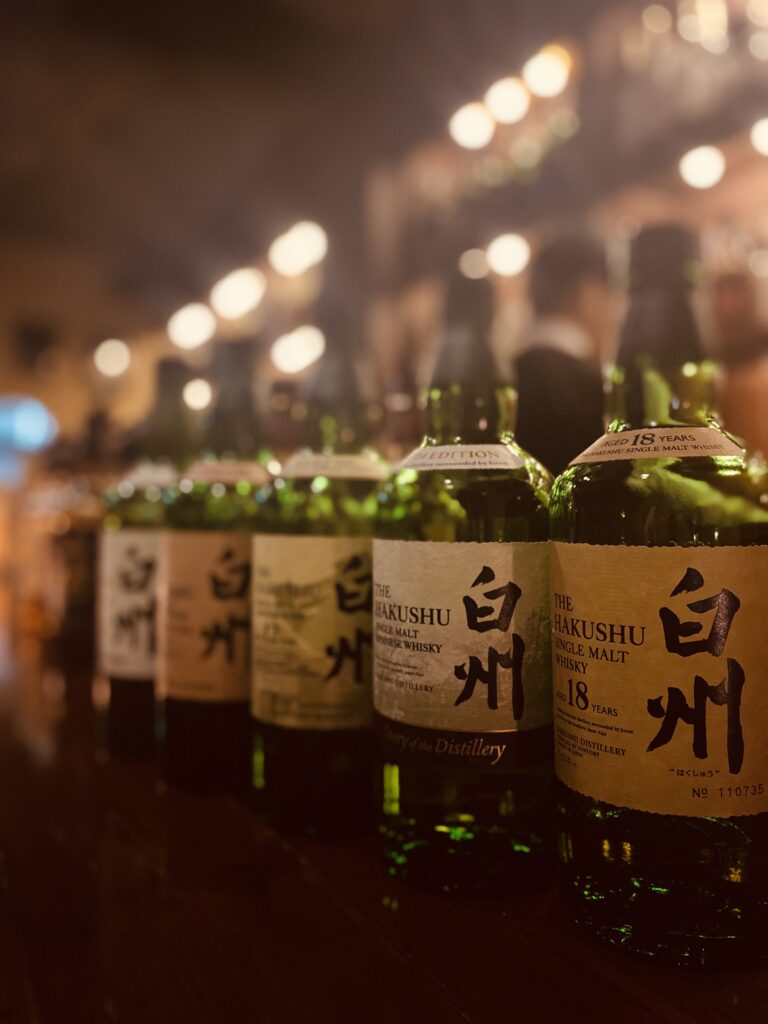 A bottle of Hakushu Single Malt Japanese Whisky, known for its fresh, herbal notes.