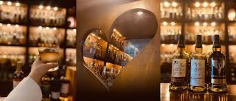 Massive collection of over 1,000 rare Japanese whiskies and rums at Bar Little Happiness Hiroshima, featuring hard-to-find craft labels.